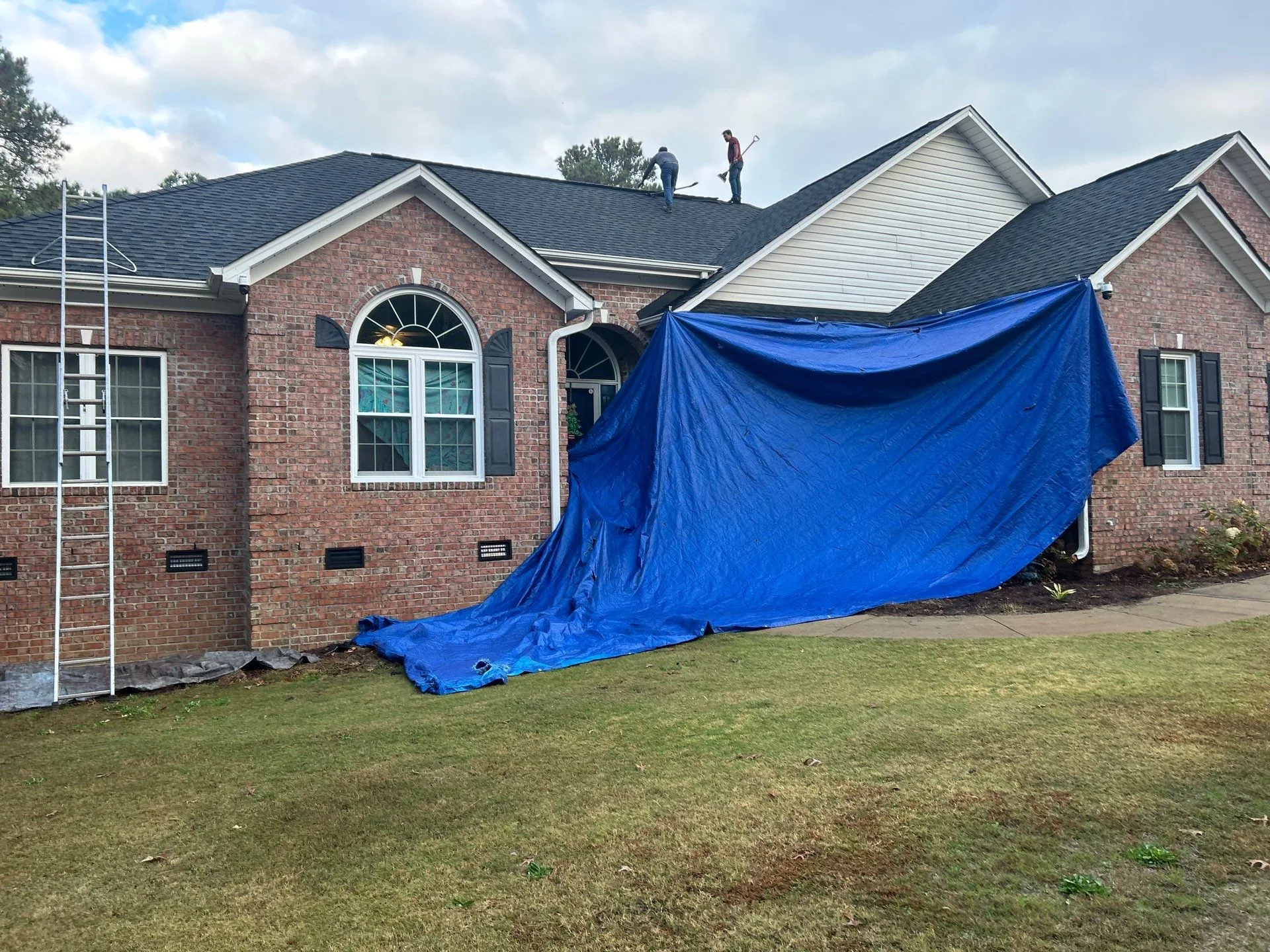 Karcher Roofing representative assisting homeowner with insurance claims process for storm damage repairs